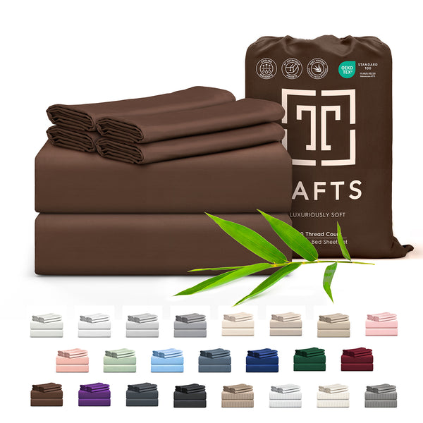 Brown bed sheets with packaging and bamboo leaves on a white background